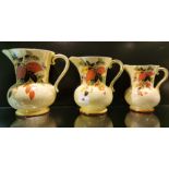 A set of three 1930's Falconware ceramic jugs, largest 20cm.