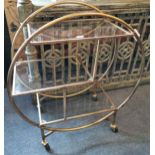 A vintage style gilt metal and glass drinks trolley, W. 82cm x H. 93cm.