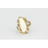 A 9ct yellow gold ring set with a baroque pearl and diamonds, L. 2.5cm, (N).