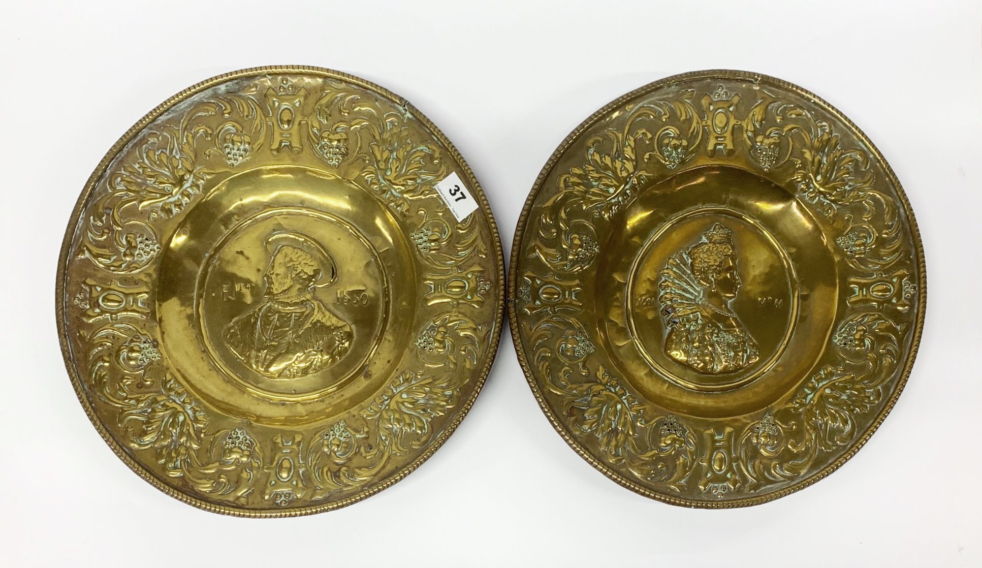 A pair of early German hammered brass alms bowls, Dia. 37.5cm. Condition report : Minor splits and