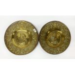 A pair of early German hammered brass alms bowls, Dia. 37.5cm. Condition report : Minor splits and