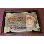 A vintage reproduction Coca-Cola advertising mirror, frame size 99cm x 70cm.