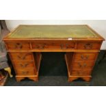 A leather topped reproduction desk, 120cm x 60cm x 78cm, together with a leather upholstered chair.