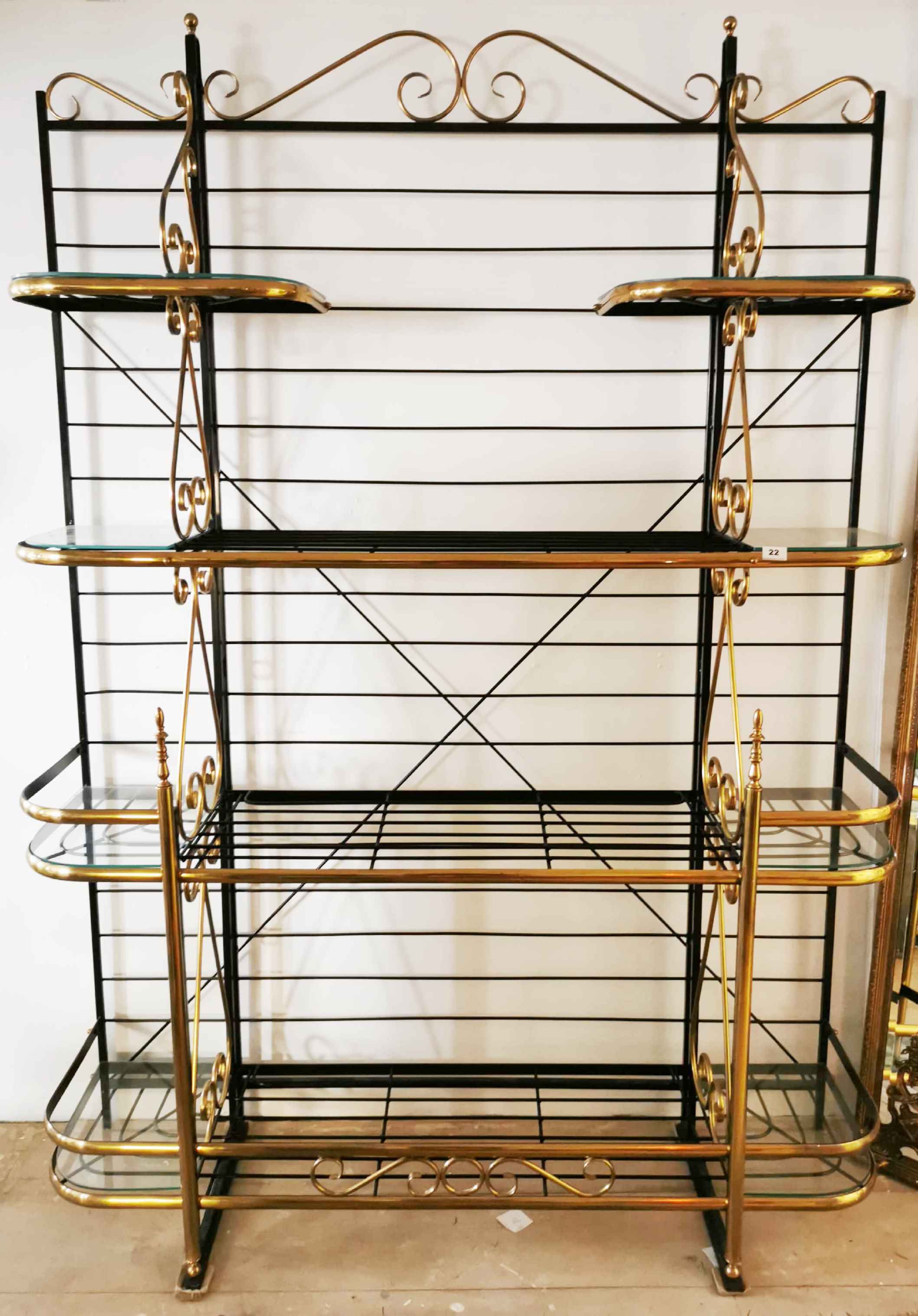A superb large gilt brass painted metal and glass baker's rack shelving unit, W. 148cm x H. 220cm.