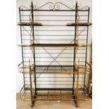 A superb large gilt brass painted metal and glass baker's rack shelving unit, W. 148cm x H. 220cm.