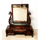 An early 19th C. mahogany veneered dressing mirror with three drawers, H. 74cm.