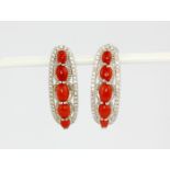 A pair of 925 silver earrings set with cabochon cut coral and white stones, L. 2.5cm.