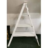 A 1950's wooden folding ladder painted and adapted as a shop display stand, H. 168cm, max W. 132cm.