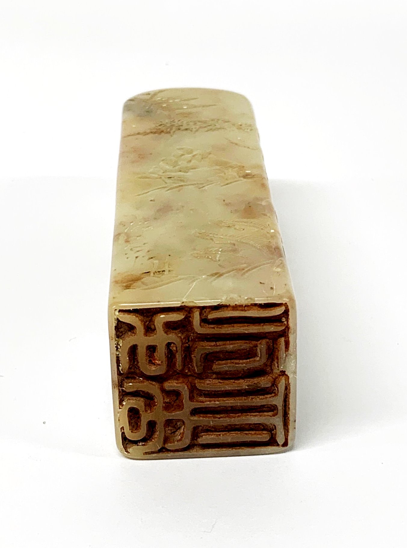 A mid 20th Century Chinese carved soapstone scholar's seal featuring a scholar and his acolyte in - Image 2 of 2