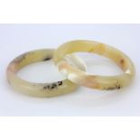 A stunning pair of polished banded and moss agate bangles, W. 12.5mm internal Dia. 6cm.