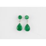 A pair of 14ct white gold drop earrings set with round and pear cut emeralds, L. 1.6cm.