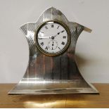 An early 20th C. hallmarked silver lady's bedside/desk clock with engine turned decoration, H.