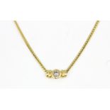 An 18ct yellow gold (stamped 750) necklace set with a brilliant cut diamond, L. 42cm.