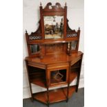 An early 20th C carved mahogany mirror backed cabinet, W. 108cm, H. 182cm.