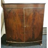 A Georgian mahogany and mahogany veneered inlaid bow front cabinet. 94cm x 106cm.