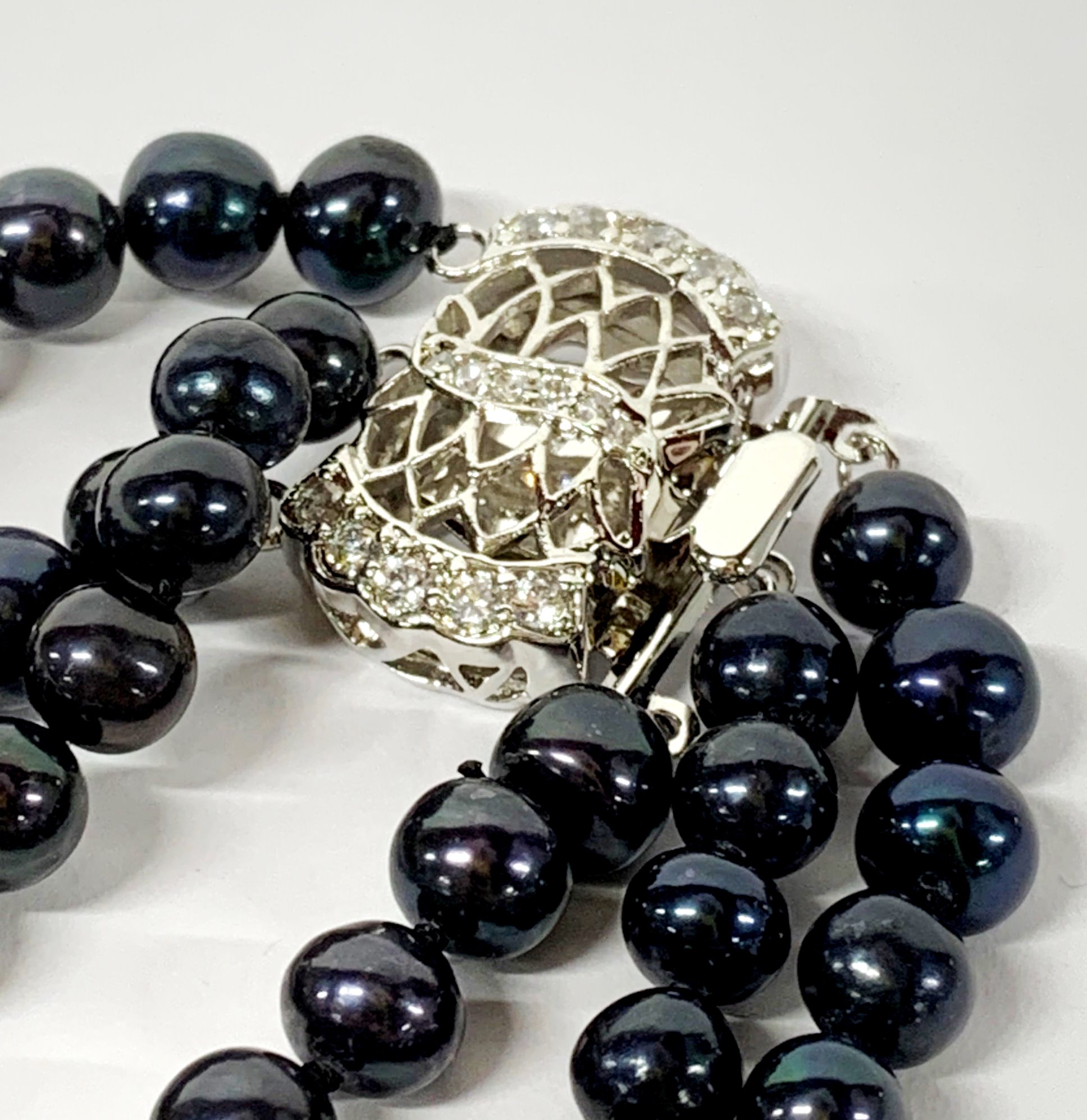 A pretty three row necklace of blue black 6mm cultured pearls, shortest row L. 38cm, together with a - Image 2 of 2