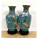 A pair of Chinese clossoine vases on copper, mid 20th C. decorated with flowers on a blue cloud