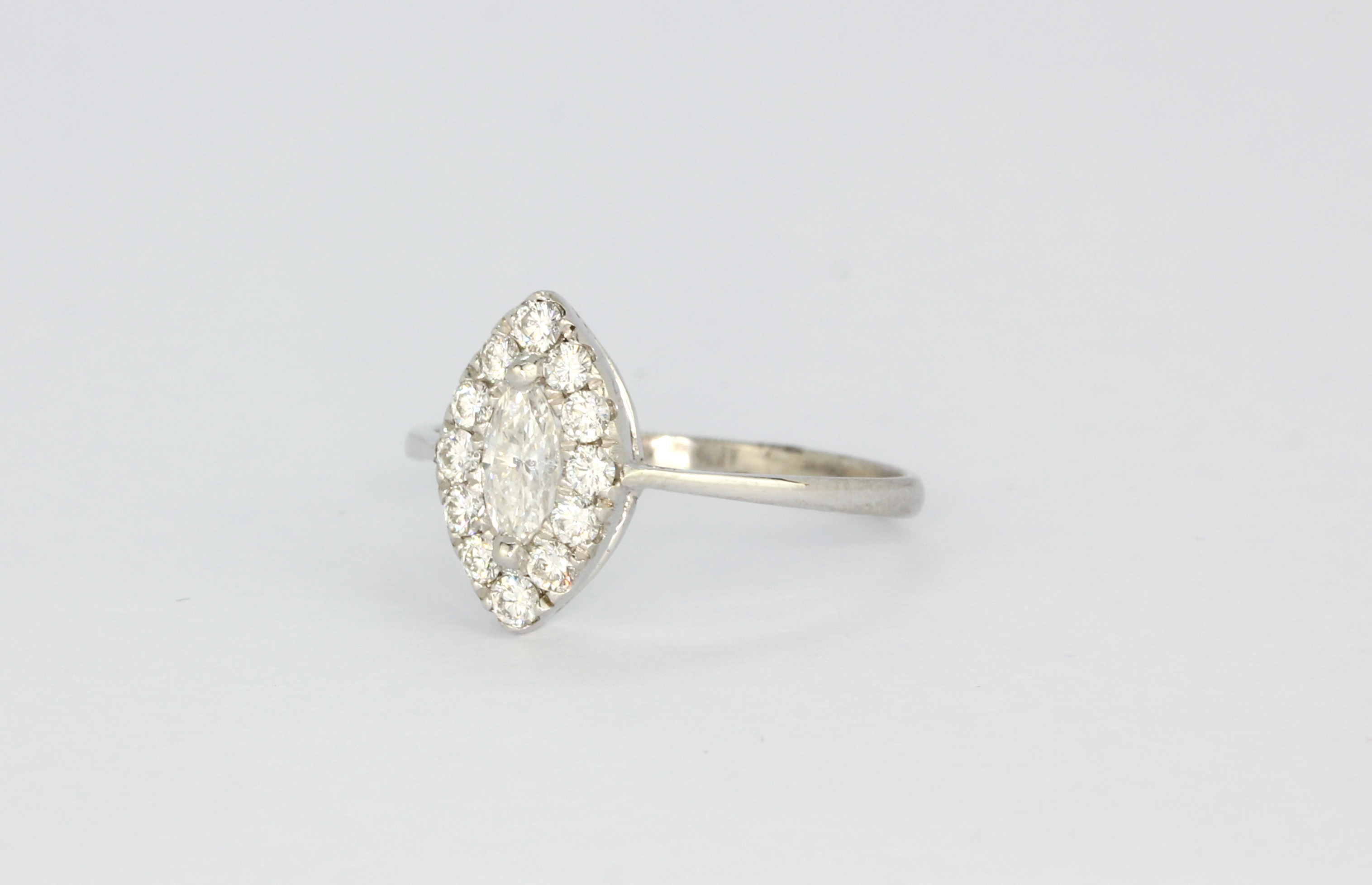 A white metal (tested 18ct gold) ring set with marquise and brilliant cut diamonds, (N). - Bild 3 aus 3
