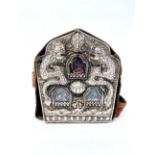 A large Tibetan hammered copper and white metal ga'u (portable shrine) housing three cold painted