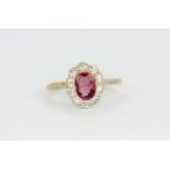 An 18ct yellow gold cluster ring set with a pink spinel and diamonds, (M).