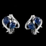 A pair of 925 silver earrings set with pear cut sapphires and white stones, L. 1.5cm.