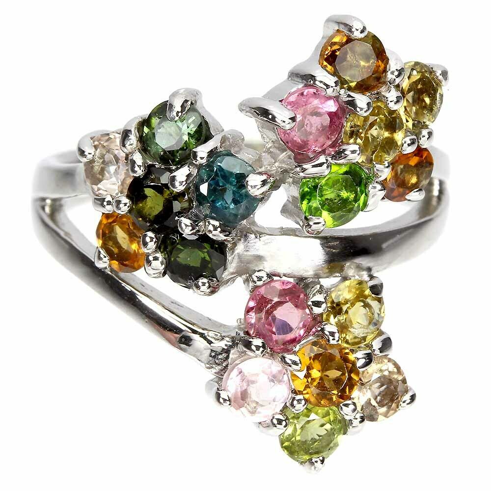 A 925 silver flower shaped crossover ring set with mixed colour tourmalines.