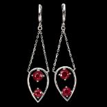 A pair of 925 silver drop earrings set with round cut rubies, L. 6cm.