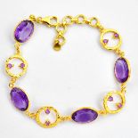 A 925 silver gilt bracelet set with oval cut amethysts, L. 20cm.