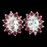 A pair of 925 silver cluster earrings set with oval cut aquamarine surrounded by rodolite garnets,