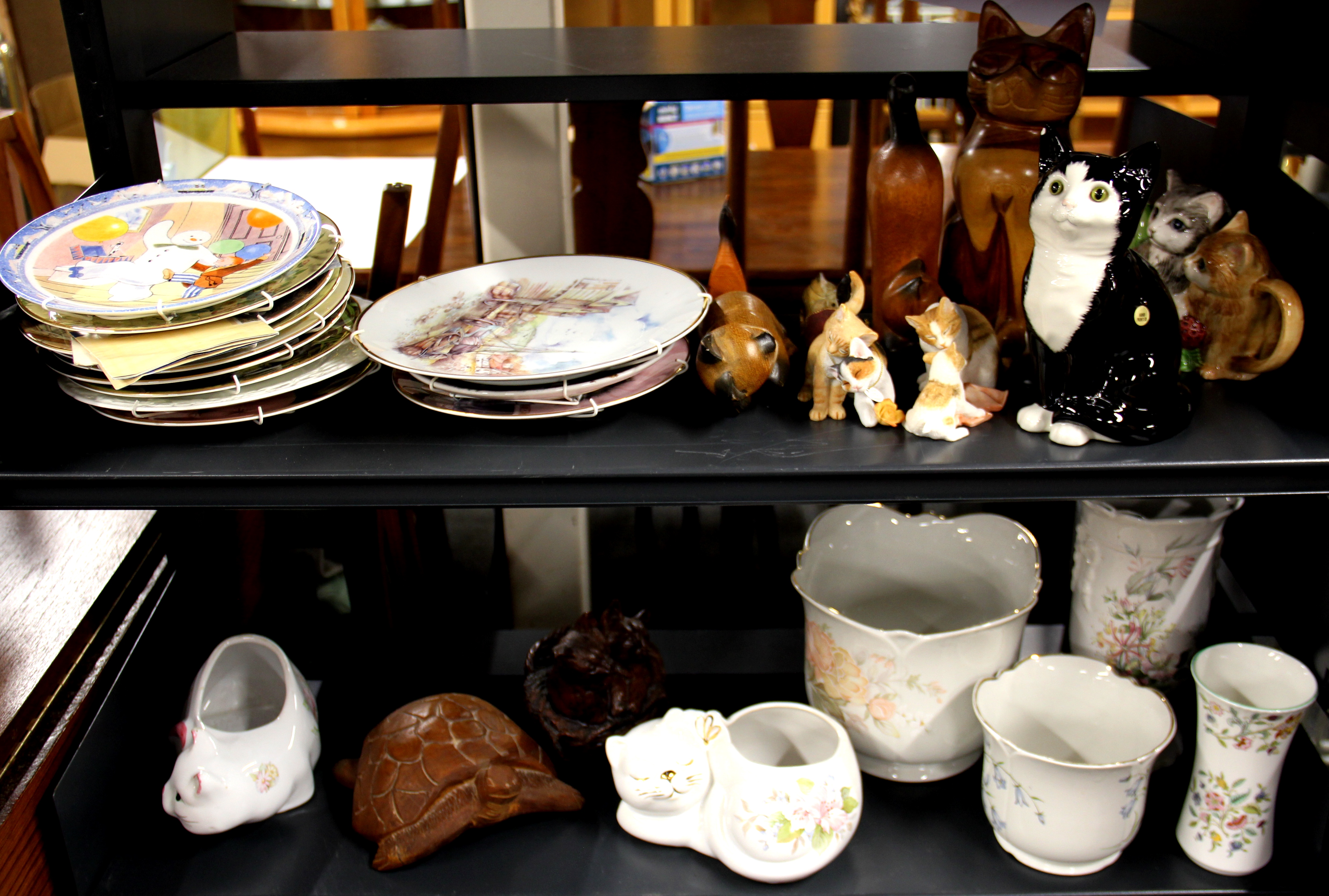 A quantity of ceramic, wooden and other cat and animal related items.