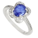 A 925 silver cluster ring set with an oval cut sapphire and white topaz, (O).