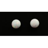 A pair of 9ct yellow gold opal set stud earrings, Dia. 0.8cm.