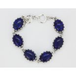 A white metal lapis lazuli set bracelet, L. 20cm.