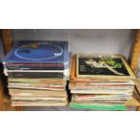 A large quantity of LP records and video discs.