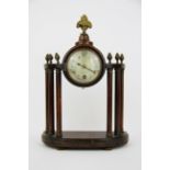 An early 20th C walnut and brass mounted clock, H. 29cm.