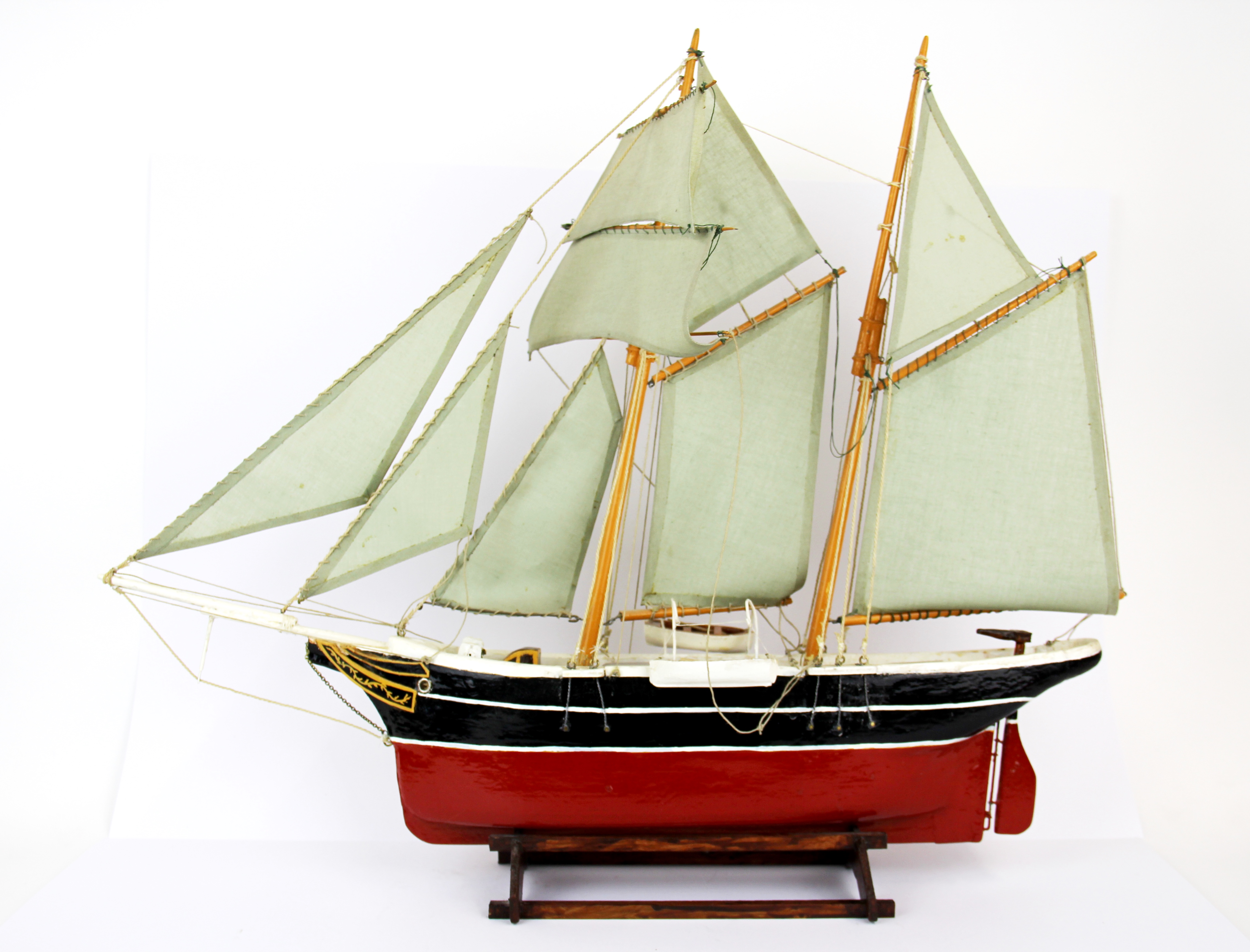 A handmade wooden model of a sailing barge, L. 58cm, H. 47cm.