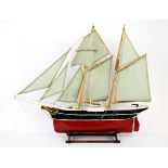 A handmade wooden model of a sailing barge, L. 58cm, H. 47cm.