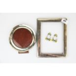 Two hallmarked silver photo frames, largest 17x22cm, together with a pair of enamelled miniature 925