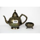 An Elkington's Sydney silver played teapot and Indian white metal bowl.