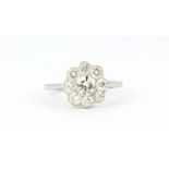 An 18ct white gold diamond set cluster ring, (P).