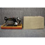 A vintage Harris hand crank sewing machine.