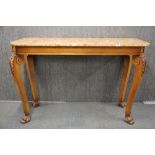 A 20th C. carved wooden double sided console with marble top, W. 131 X 49 x 89cm.