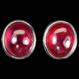 A pair of 925 silver stud earrings set with cabochon cut rubies, 1.4 x 1.2cm.