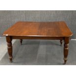 A Victorian wind out oak dining table, 148 x 118cm. extending to 190cm.