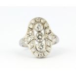 A white metal (tested 18ct gold) ring set with brilliant cut diamonds, approx. 1.25ct, (P.5).