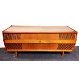 A 1970's HMV teak radiogram, W. 143cm.