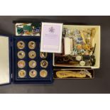 12 enamelled coins with a quantity of costume jewellery and watches.