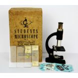 A boxed vintage students microscope, box length 19cm.
