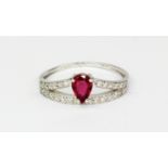 A 18ct white gold ring set with a pear cut unheated ruby and diamond set shoulders, approx. 0.45ct