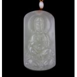 A Chinese carved mutton fat jade amulet of Guanyin, L. 6.5cm.